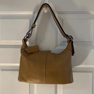 Coach adjustable bag.  Tan in color.  Used three times.  Looks like new.